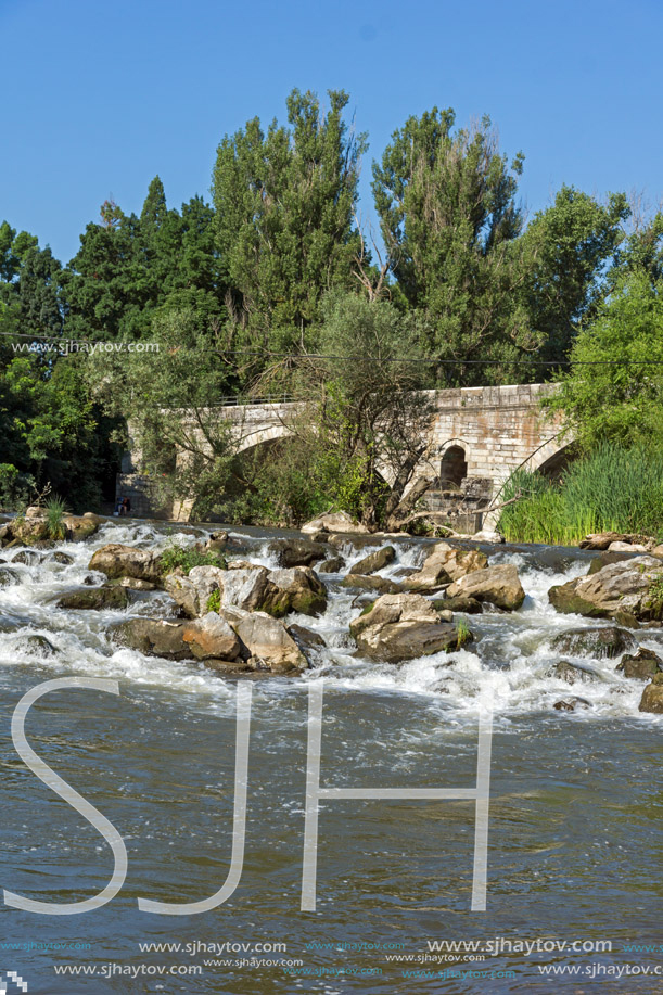 Summer view of Kadin most - a 15th-century stone arch bridge over the Struma River at Nevestino, Kyustendil Province, Bulgaria