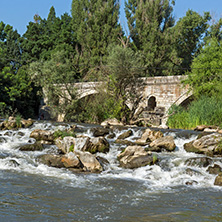 Summer view of Kadin most - a 15th-century stone arch bridge over the Struma River at Nevestino, Kyustendil Province, Bulgaria