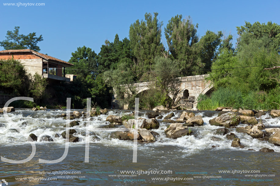 Summer view of Kadin most - a 15th-century stone arch bridge over the Struma River at Nevestino, Kyustendil Province, Bulgaria