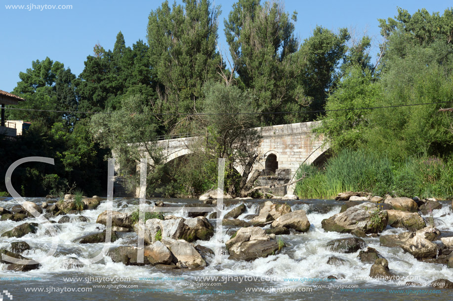 Summer view of Kadin most - a 15th-century stone arch bridge over the Struma River at Nevestino, Kyustendil Province, Bulgaria