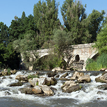 Summer view of Kadin most - a 15th-century stone arch bridge over the Struma River at Nevestino, Kyustendil Province, Bulgaria