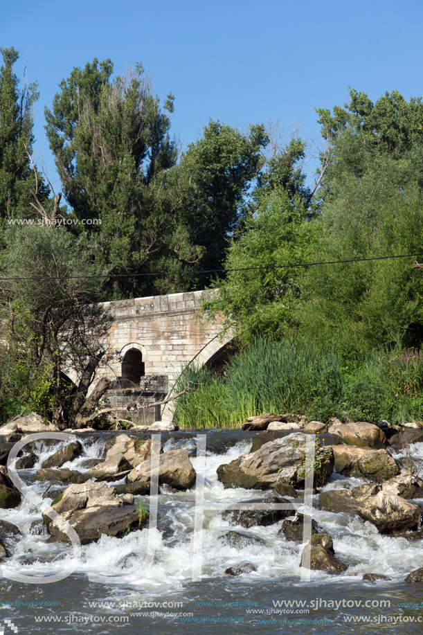 Summer view of Kadin most - a 15th-century stone arch bridge over the Struma River at Nevestino, Kyustendil Province, Bulgaria