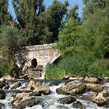 Summer view of Kadin most - a 15th-century stone arch bridge over the Struma River at Nevestino, Kyustendil Province, Bulgaria