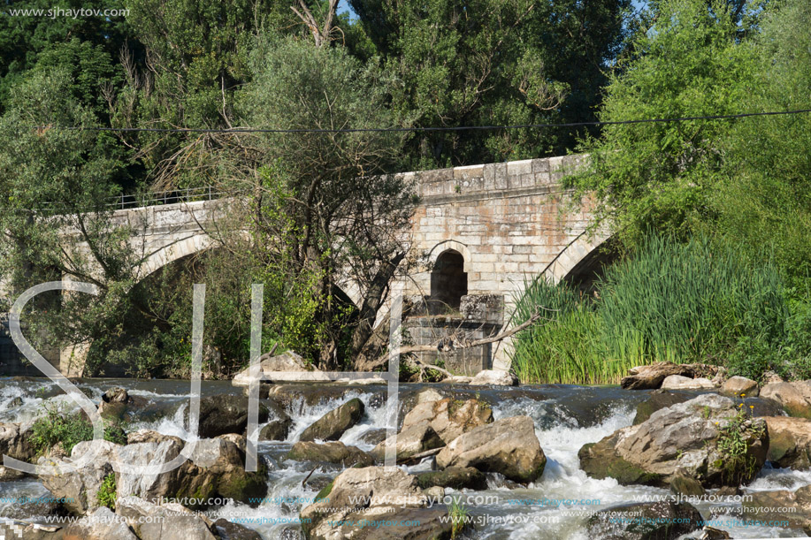 Summer view of Kadin most - a 15th-century stone arch bridge over the Struma River at Nevestino, Kyustendil Province, Bulgaria