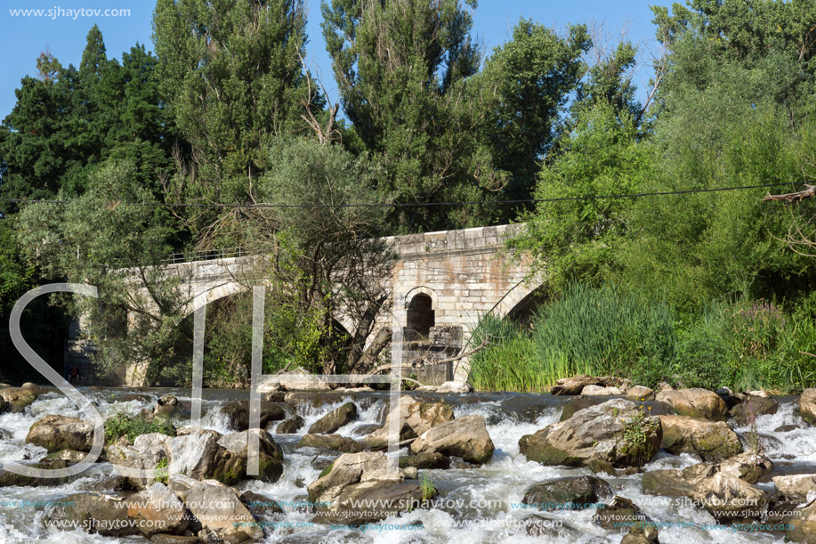 Summer view of Kadin most - a 15th-century stone arch bridge over the Struma River at Nevestino, Kyustendil Province, Bulgaria