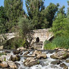 Summer view of Kadin most - a 15th-century stone arch bridge over the Struma River at Nevestino, Kyustendil Province, Bulgaria