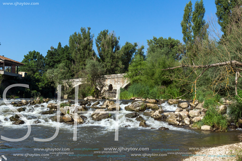 Summer view of Kadin most - a 15th-century stone arch bridge over the Struma River at Nevestino, Kyustendil Province, Bulgaria