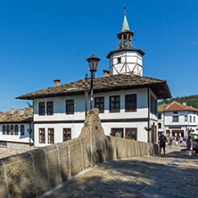 TRYAVNA, BULGARIA - JULY 6, 2018: Garbaviat (Humpback) Bridge and Medieval clock Tower at the Center of historical town of Tryavna, Gabrovo region, Bulgaria