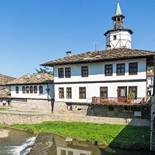 TRYAVNA, BULGARIA - JULY 6, 2018: Garbaviat (Humpback) Bridge and Medieval clock Tower at the Center of historical town of Tryavna, Gabrovo region, Bulgaria