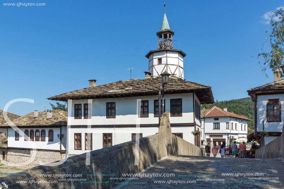 TRYAVNA, BULGARIA - JULY 6, 2018: Garbaviat (Humpback) Bridge and Medieval clock Tower at the Center of historical town of Tryavna, Gabrovo region, Bulgaria