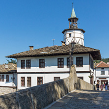 TRYAVNA, BULGARIA - JULY 6, 2018: Garbaviat (Humpback) Bridge and Medieval clock Tower at the Center of historical town of Tryavna, Gabrovo region, Bulgaria