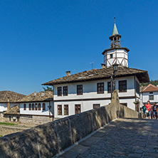 TRYAVNA, BULGARIA - JULY 6, 2018: Garbaviat (Humpback) Bridge and Medieval clock Tower at the Center of historical town of Tryavna, Gabrovo region, Bulgaria