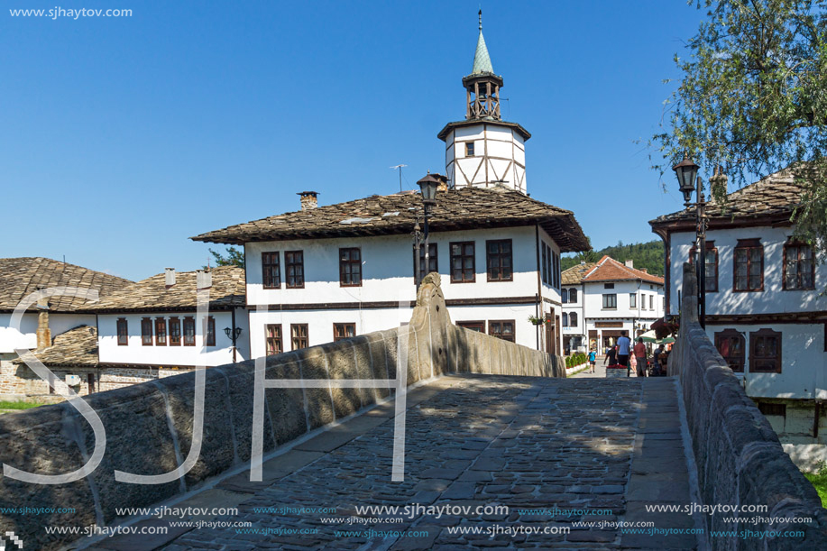 TRYAVNA, BULGARIA - JULY 6, 2018: Garbaviat (Humpback) Bridge and Medieval clock Tower at the Center of historical town of Tryavna, Gabrovo region, Bulgaria