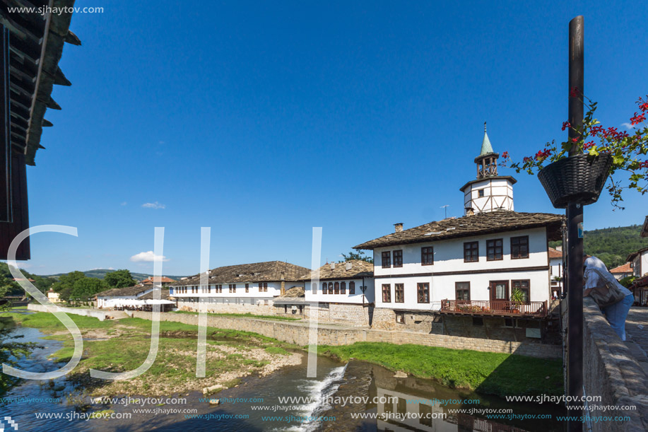 TRYAVNA, BULGARIA - JULY 6, 2018: Garbaviat (Humpback) Bridge and Medieval clock Tower at the Center of historical town of Tryavna, Gabrovo region, Bulgaria