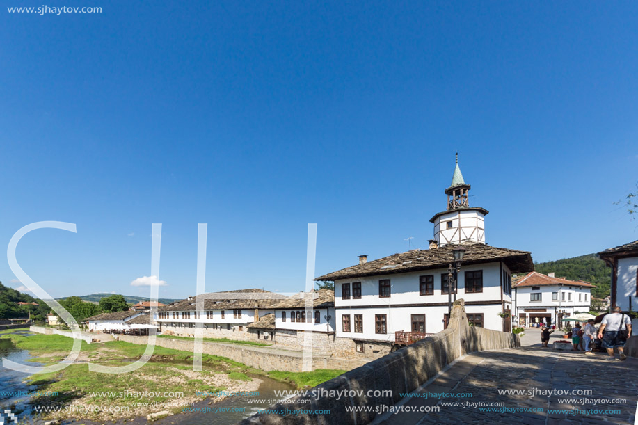 TRYAVNA, BULGARIA - JULY 6, 2018: Garbaviat (Humpback) Bridge and Medieval clock Tower at the Center of historical town of Tryavna, Gabrovo region, Bulgaria