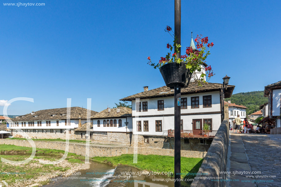 TRYAVNA, BULGARIA - JULY 6, 2018: Garbaviat (Humpback) Bridge and Medieval clock Tower at the Center of historical town of Tryavna, Gabrovo region, Bulgaria