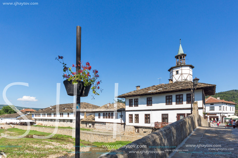 TRYAVNA, BULGARIA - JULY 6, 2018: Garbaviat (Humpback) Bridge and Medieval clock Tower at the Center of historical town of Tryavna, Gabrovo region, Bulgaria