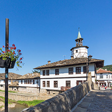 TRYAVNA, BULGARIA - JULY 6, 2018: Garbaviat (Humpback) Bridge and Medieval clock Tower at the Center of historical town of Tryavna, Gabrovo region, Bulgaria