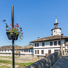 TRYAVNA, BULGARIA - JULY 6, 2018: Garbaviat (Humpback) Bridge and Medieval clock Tower at the Center of historical town of Tryavna, Gabrovo region, Bulgaria