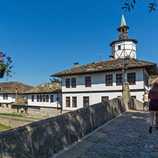 TRYAVNA, BULGARIA - JULY 6, 2018: Garbaviat (Humpback) Bridge and Medieval clock Tower at the Center of historical town of Tryavna, Gabrovo region, Bulgaria