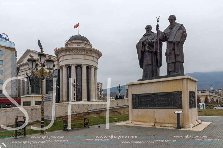 SKOPJE, REPUBLIC OF MACEDONIA - FEBRUARY 24, 2018:  Monument of St. Cyril and Methodius and Archaeological Museum in Skopje, Republic of Macedonia