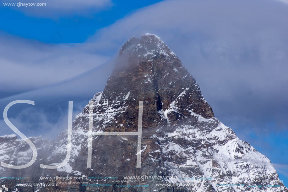 Amazing Winter view of mount Matterhorn covered with clouds, Canton of Valais, Alps, Switzerland