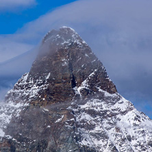 Amazing Winter view of mount Matterhorn covered with clouds, Canton of Valais, Alps, Switzerland