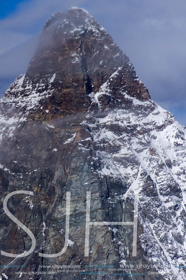 Amazing Winter view of mount Matterhorn covered with clouds, Canton of Valais, Alps, Switzerland