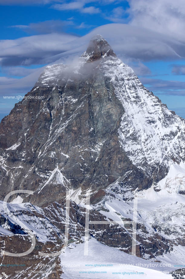 Amazing Winter view of mount Matterhorn covered with clouds, Canton of Valais, Alps, Switzerland