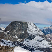 Amazing Winter view of mount Matterhorn covered with clouds, Canton of Valais, Alps, Switzerland