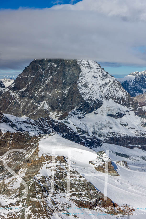 Amazing Winter view of mount Matterhorn covered with clouds, Canton of Valais, Alps, Switzerland