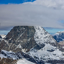 Amazing Winter view of mount Matterhorn covered with clouds, Canton of Valais, Alps, Switzerland