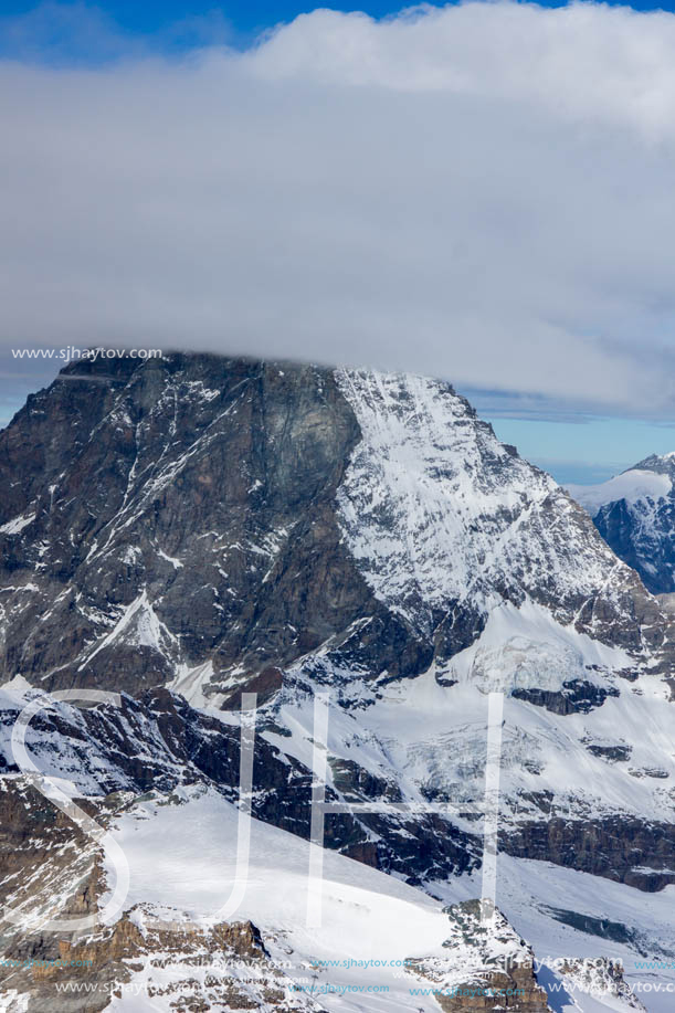 Amazing Winter view of mount Matterhorn covered with clouds, Canton of Valais, Alps, Switzerland