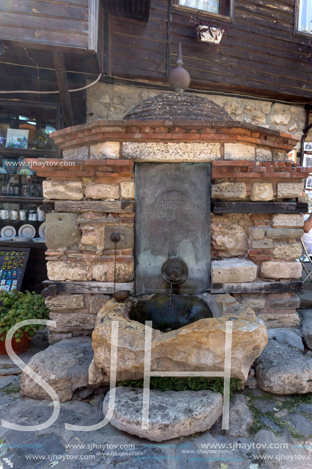 NESSEBAR, BULGARIA - AUGUST 12, 2018: The Old Fountain in old town of Nessebar, Burgas Region, Bulgaria